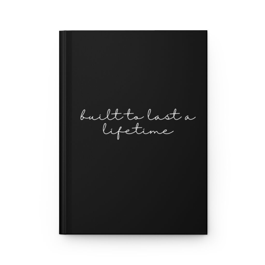 Black book cover with the title "built to last a lifetime" in white, handwritten style font, conveying introspection and personal reflection by iziiexpressions.com