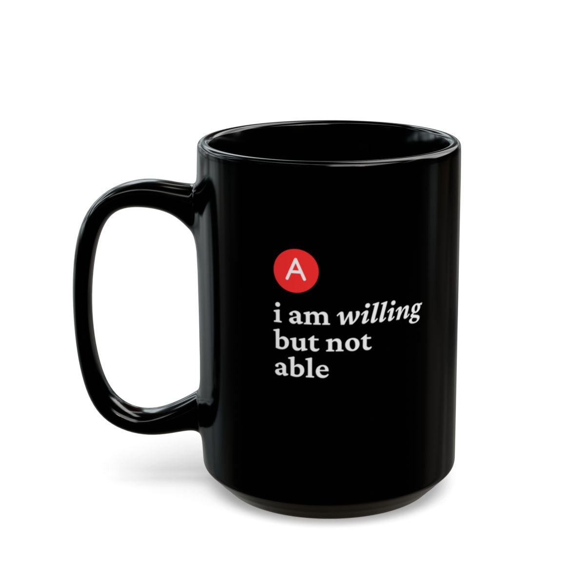 A black coffee mug features the quote, "B. I am willing but not able,  in white text with a red circle around a bold "A."
